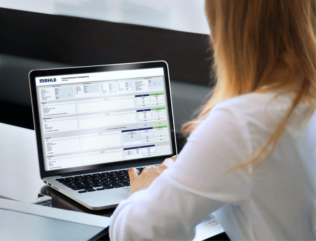 Back view of businesswoman speak using Webcam conference on laptop with diverse colleagues, female employee talk on video call with multiracial coworkers engaged in online briefing from home