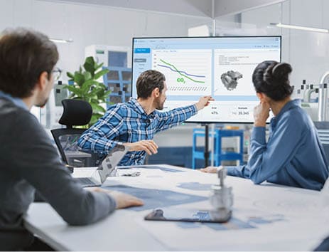 Modern Factory Office Meeting Room: Diverse Team of Engineers, Managers and Investors Talking at Conference Table, Use Interactive TV, Analyze Sustainable Energy Engine Blueprints. High-Tech Facility