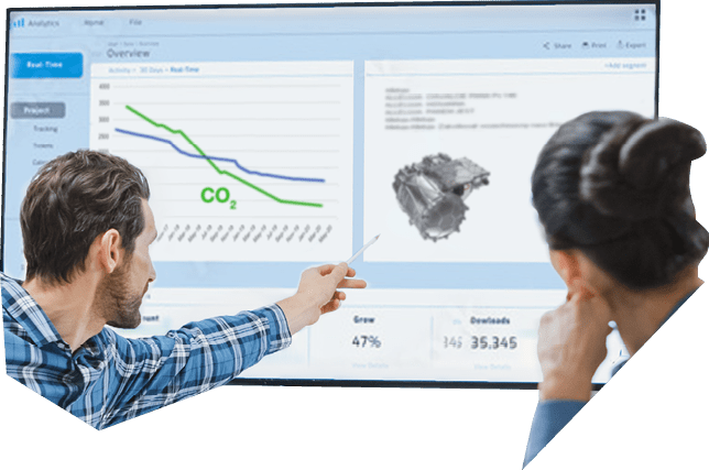 Modern Factory Office Meeting Room: Diverse Team of Engineers, Managers and Investors Talking at Conference Table, Use Interactive TV, Analyze Sustainable Energy Engine Blueprints. High-Tech Facility