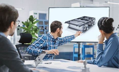 Modern Factory Office Meeting Room: Diverse Team of Engineers, Managers and Investors Talking at Conference Table, Use Interactive TV, Analyze Sustainable Energy Engine Blueprints. High-Tech Facility