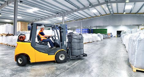Workers with forklift in the depot, Saxony-Anhalt, Germany (Logistik, Lager, Spedition, Warenhaus, Transport)