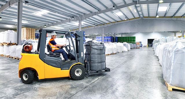 Workers with forklift in the depot, Saxony-Anhalt, Germany (Logistik, Lager, Spedition, Warenhaus, Transport)