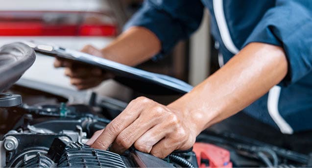 Automobile mechanic repairman hands repairing a car engine automotive workshop with a wrench, car service and maintenance,Repair service.
